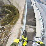 Biker Balances on Handrail Above 600ft Dam